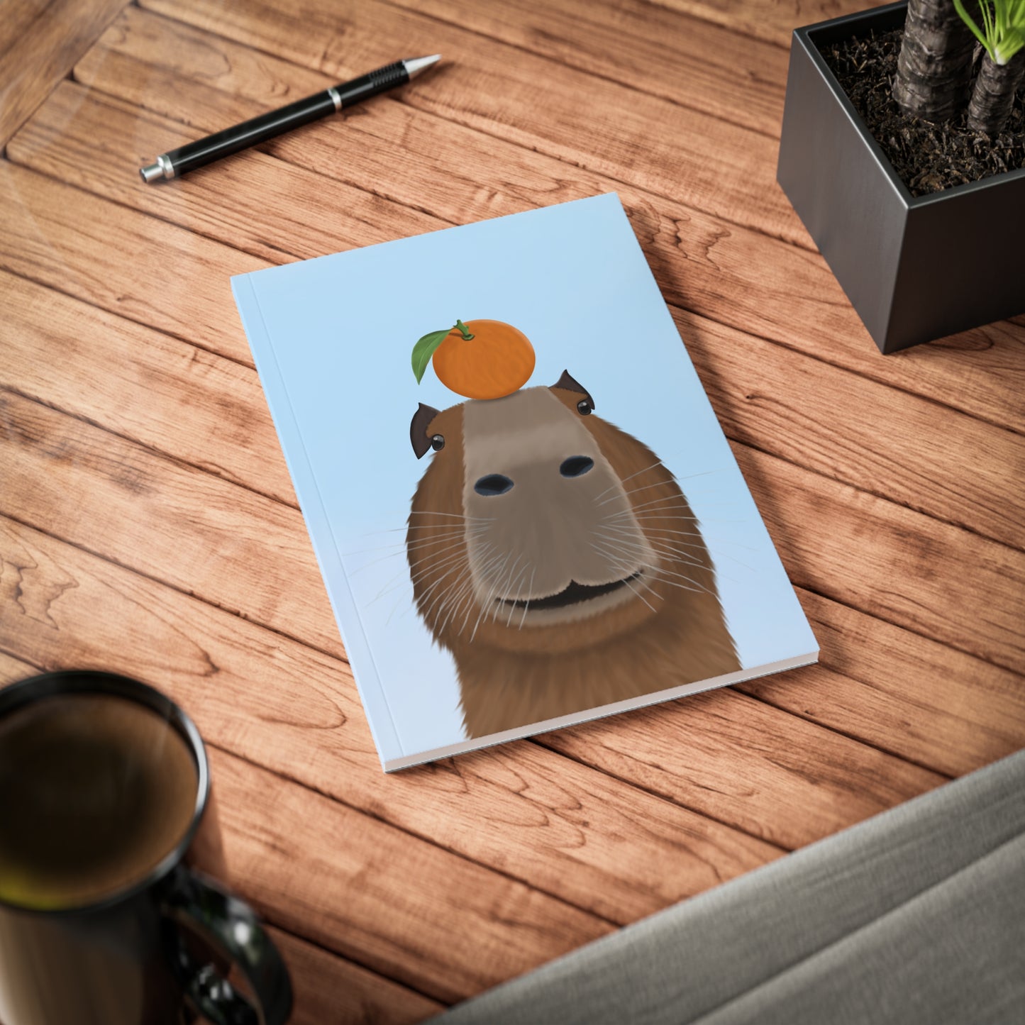 Capybara mit Orange A5 Softcover Notizbuch 150 Seiten Liniert