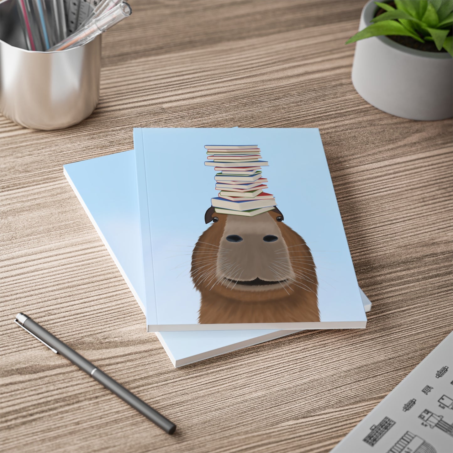 Capybara mit Büchern A5 Softcover Notizbuch 150 Seiten Liniert