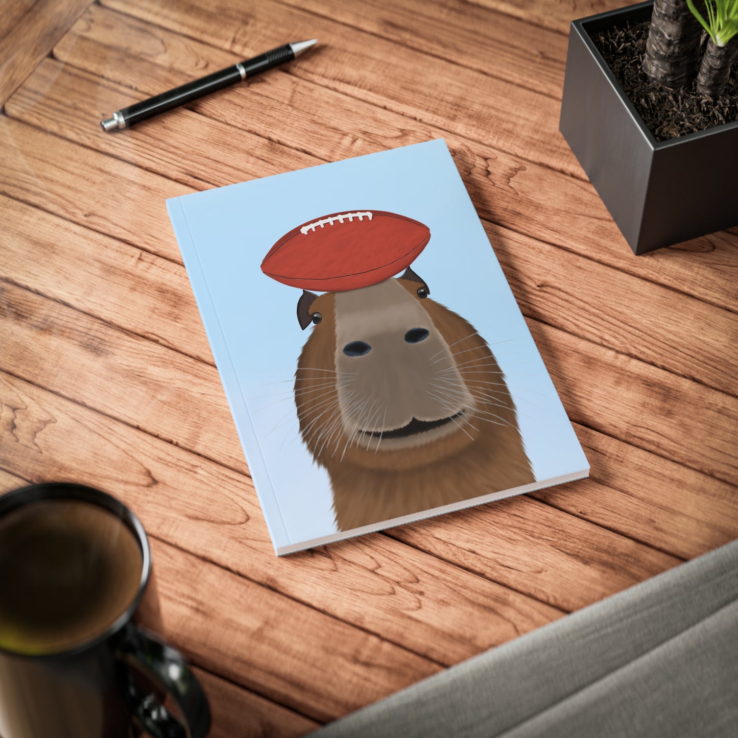 Capybara mit Football A5 Softcover Notizbuch 150 Seiten Liniert
