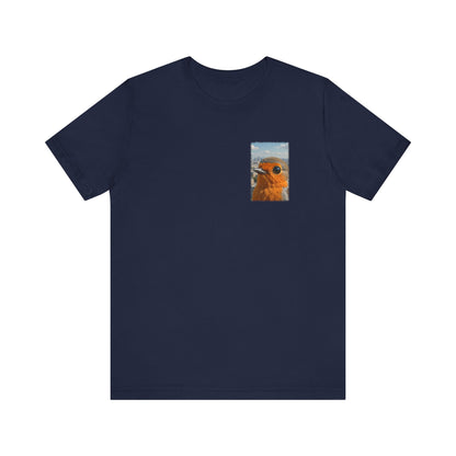 A navy blue short-sleeve crewneck t-shirt with a small square graphic print on the left chest showing a close-up of a robin bird, displayed on a solid white background.
