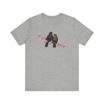 Gray t-shirt with birds and cherry blossoms design on a white background