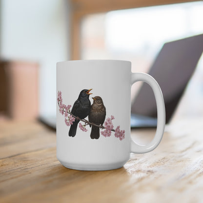 White mug with bird design on a wooden surface