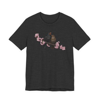 Black t-shirt with a bird and cherry blossom design on a white background