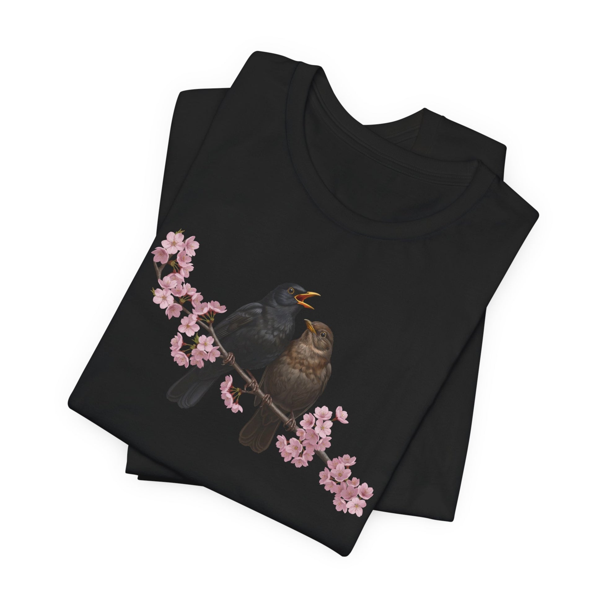 Black t-shirt with bird and cherry blossom design on a white background
