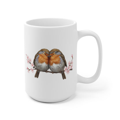 White mug with a design of two birds on a branch with pink flowers on a white background for valentine's day