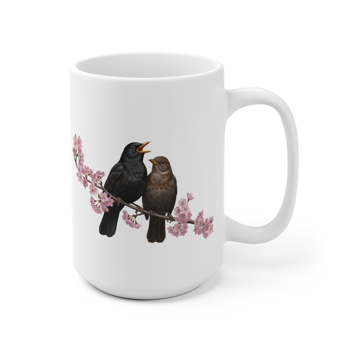 White mug with birds and cherry blossoms design on a white background