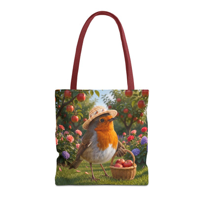 Quadratische Tragetasche aus Stoff mit roten Baumwollgriffen. Auf der Tasche ist eine digitale Illustration von einem niedlichen Rotkehlchen namens Rosi aufgedruckt, das einen Sonnenhut trägt und mit einem vollen Apfelkörbchen unter Apfelbäumen in einem Garten steht.