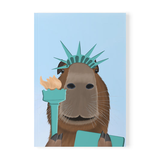Capybara als Freiheitsstatue mit Krone, Fackel und Tafel A5 Softcover Notizbuch 150 Seiten Liniert