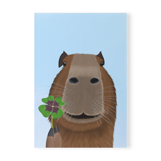 Capybara mit Glücksklee A5 Softcover Notizbuch 150 Seiten Liniert