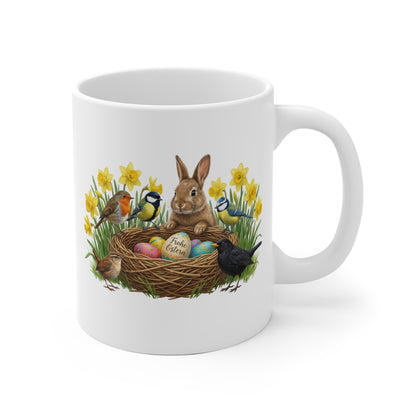 White mug with a rabbit and birds design on a white background