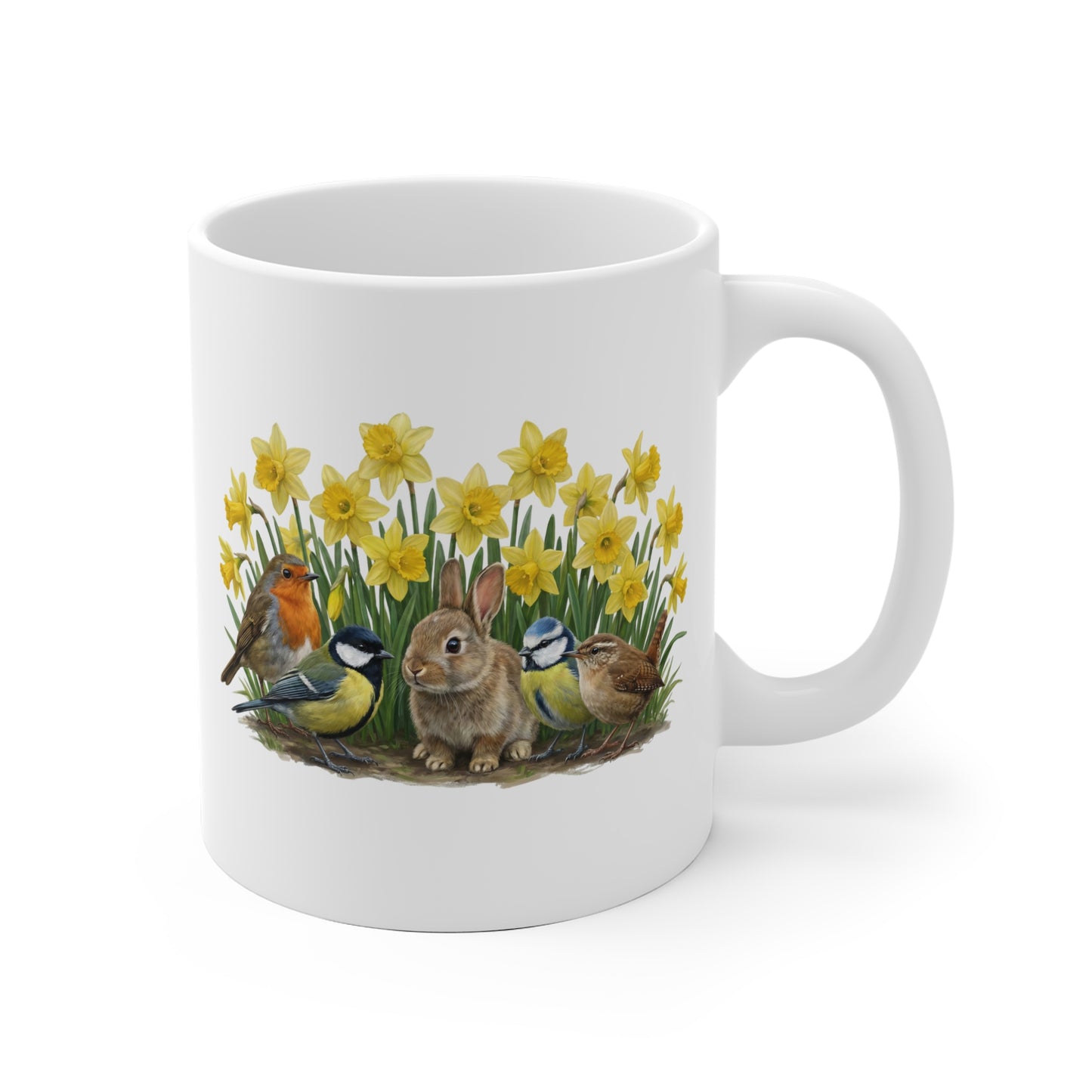 White mug with a design of birds and a rabbit among flowers on a white background
