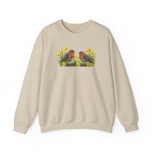Beige sweatshirt with a graphic of two european robins and flowers on a white background
