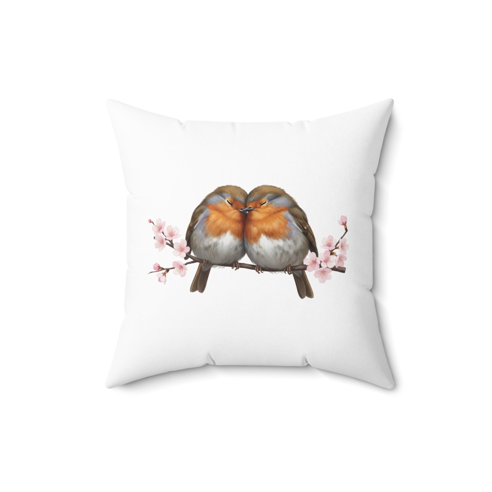 Decorative pillow with two birds on a branch with cherry blossoms design on a white background
