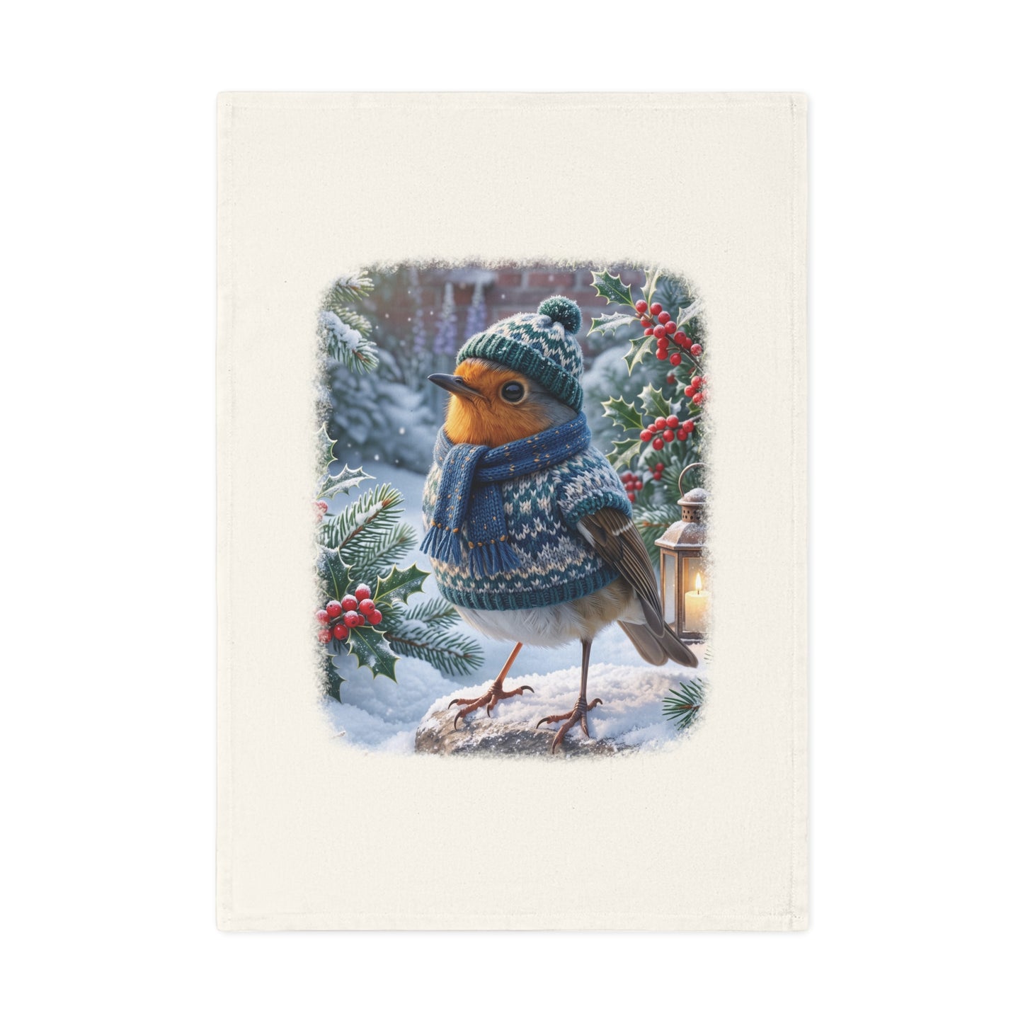 Winterliches Bio Geschirrtuch mit Vogelmotiv. Das Rotkehlchen Rosi trägt Strickmütze, Strickschal und Strickpullover in einem verschneiten Garten. Ein nachhaltiges Küchengeschenk für Vogelfreunde.
